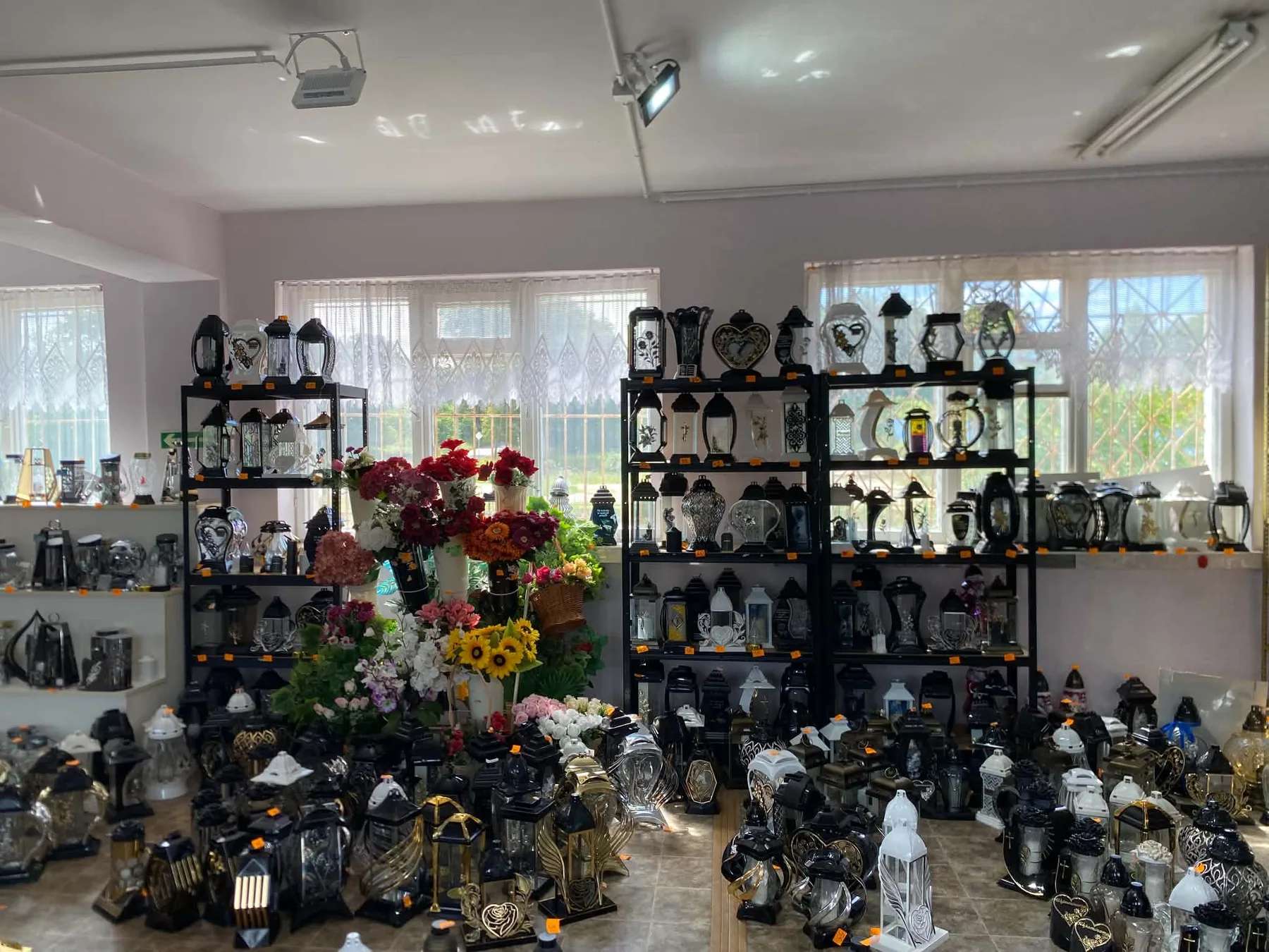 Display of EWPOL memorial candles and lanterns in the company shop